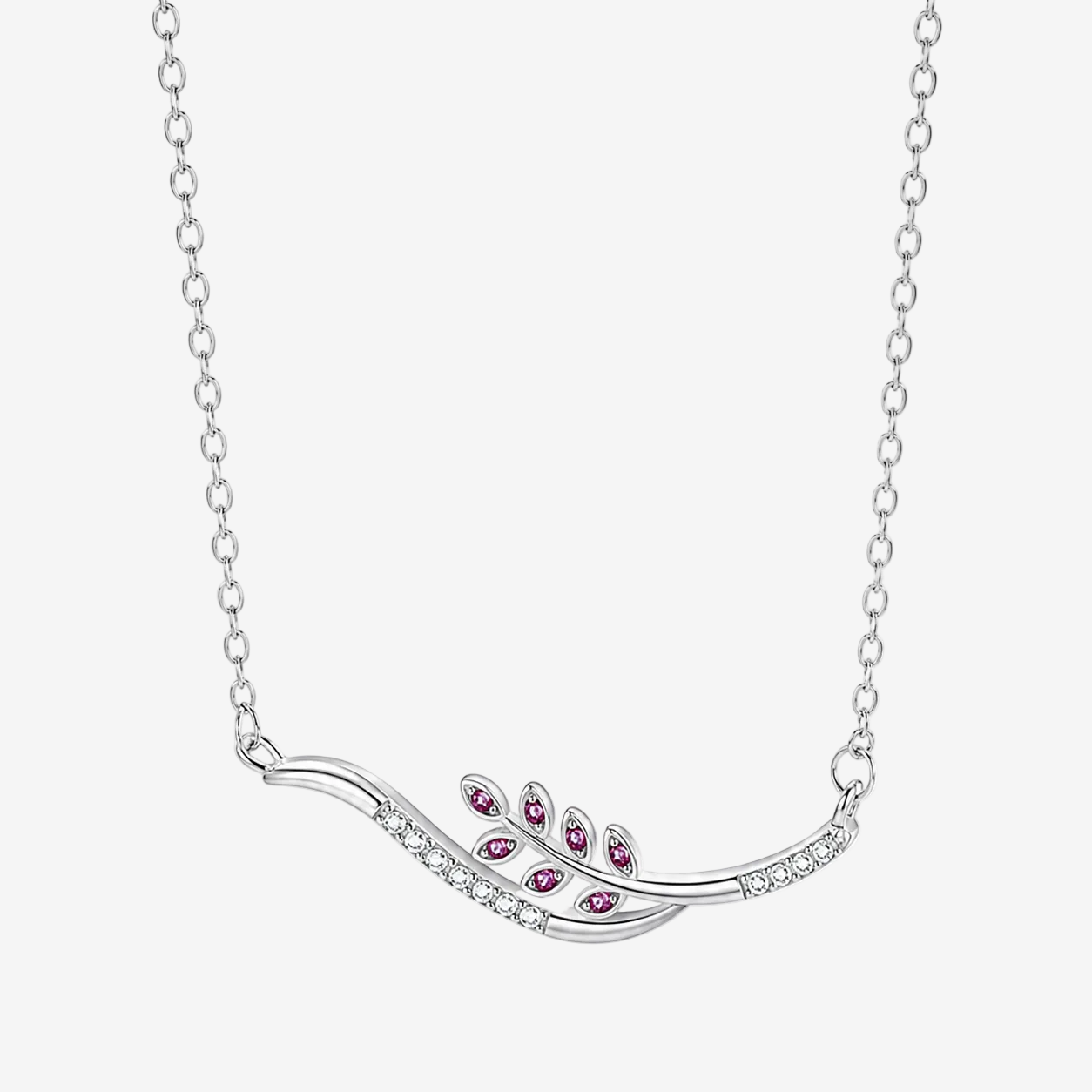 A JOET silver-toned leaf-shaped pendant necklace with small clear stones and five pink gemstone accents, shown on a white background.