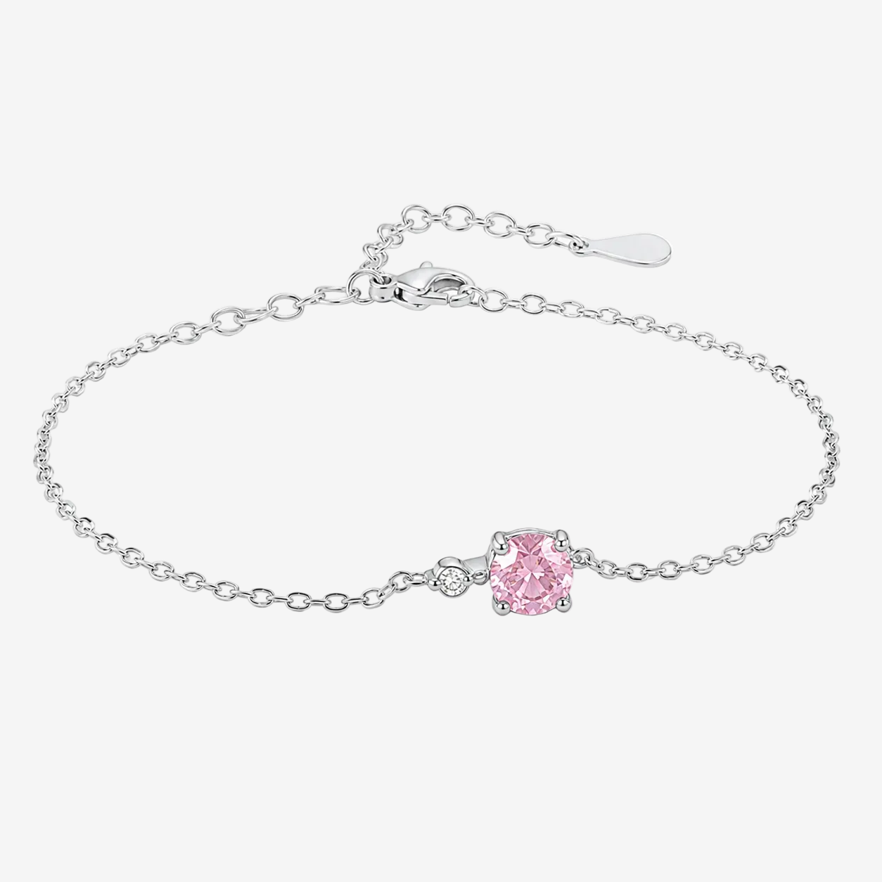 A JOET delicate silver chain bracelet featuring a central cushion-cut pink gemstone in a prong setting, with a small clear accent stone beside it. The bracelet is displayed on a clean white background.