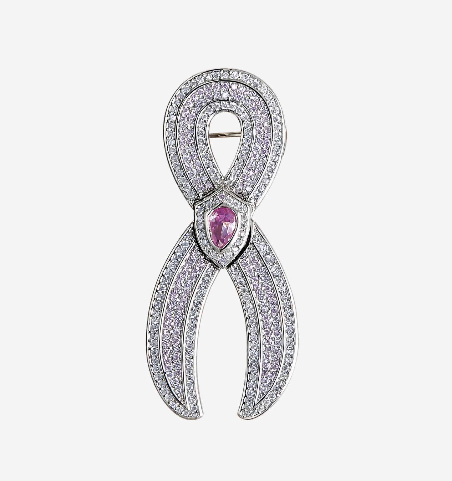 A JOET silver ribbon-shaped brooch paved with clear stones, featuring a central teardrop-shaped pink gemstone, shown on a plain white background.