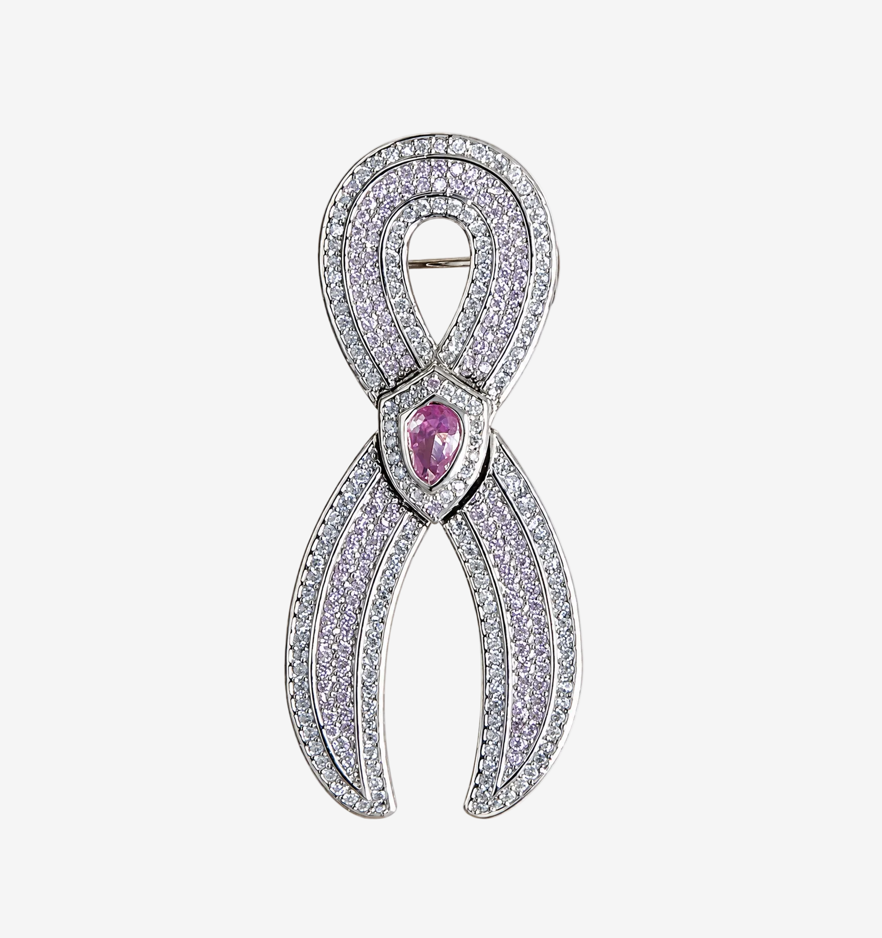 A JOET silver ribbon-shaped brooch paved with clear stones, featuring a central teardrop-shaped pink gemstone, shown on a plain white background.